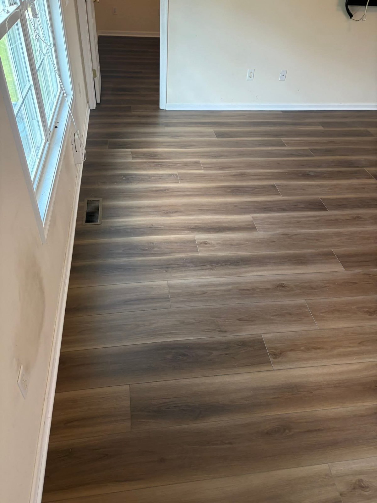 Finished flooring near a sliding door