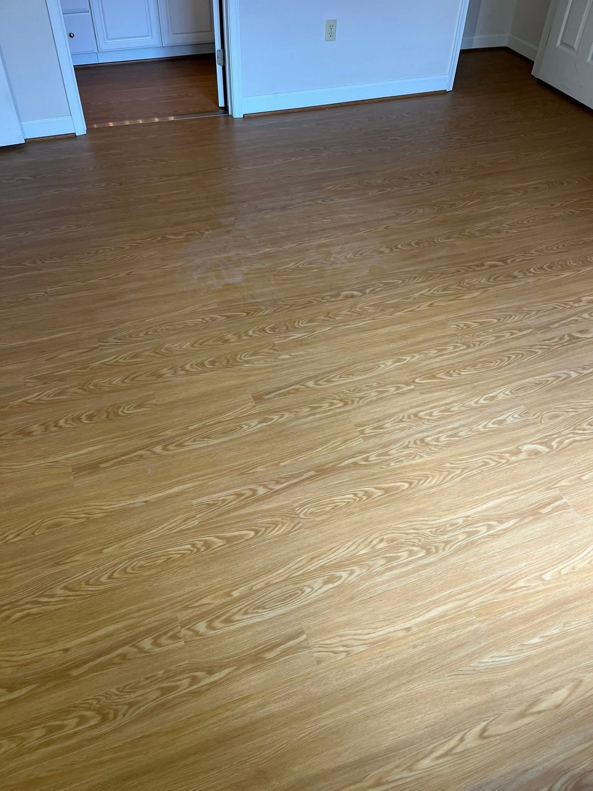 Wood-look flooring across an interior room