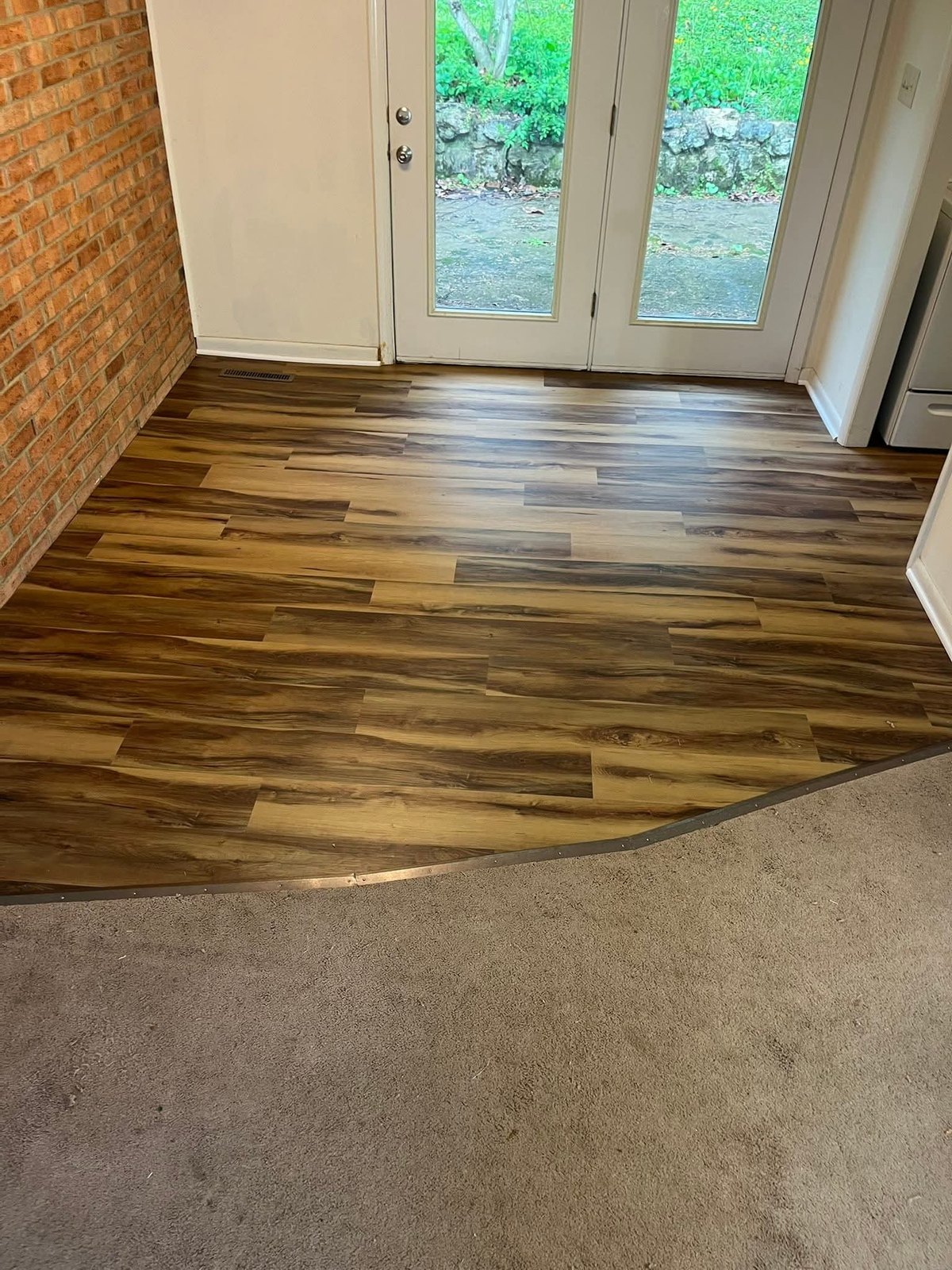 Finished flooring by French doors