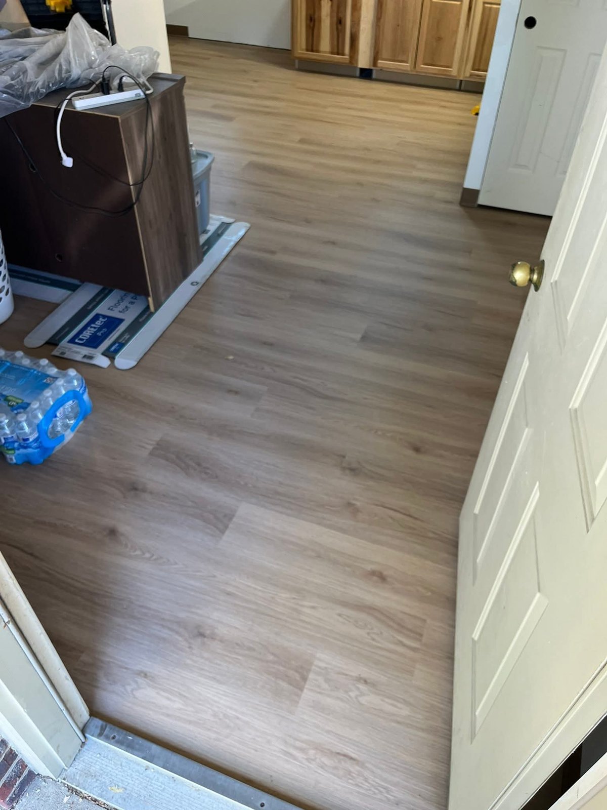 Light flooring through a hall and room