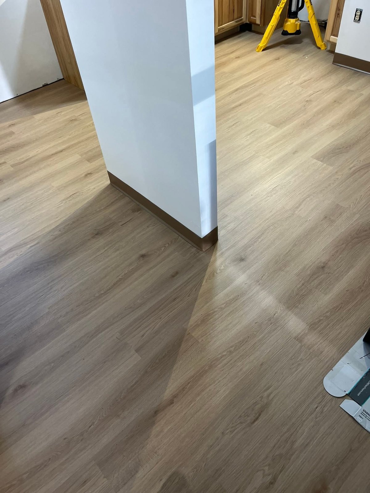 Flooring around a doorway and partition